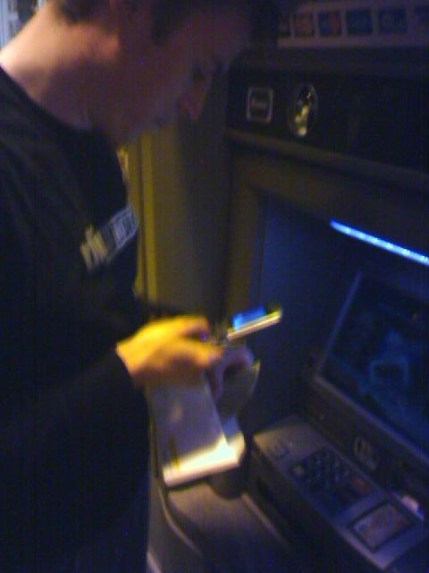 I take a picture of Dan taking a picture of his cash before deposit.